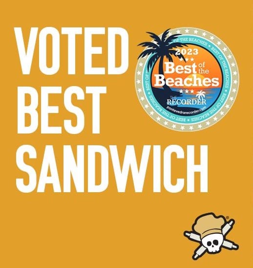 Yellow background with bold white text reading Voted Best Sandwich next to a 2023 Best of the Beaches award badge and a delicious sandwich with crossbones icon—perfect for breakfast or brunch.