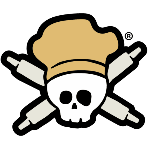 A cartoon skull wearing a tan chef’s hat with two crossed rolling pins behind it, giving off a pirate flag vibe—perfect for fans of delicious Southern cooking.